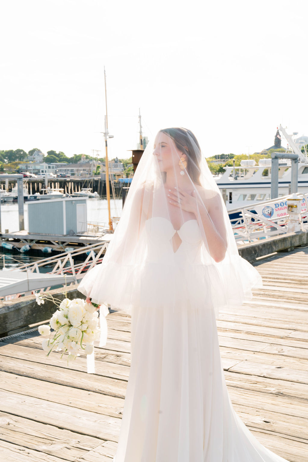 Newport Beach Wedding Venues | Rhode Island Photography By Caprio Captured Light And Airy | Bride with veil at dock
