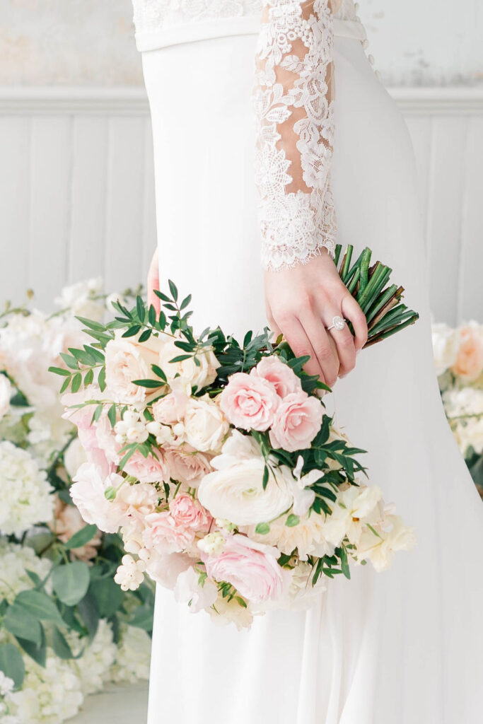 Belle Mer Wedding Price | Caprio Captured Photography Light and Airy Wedding Photography | Bride holding blush and white bouquet