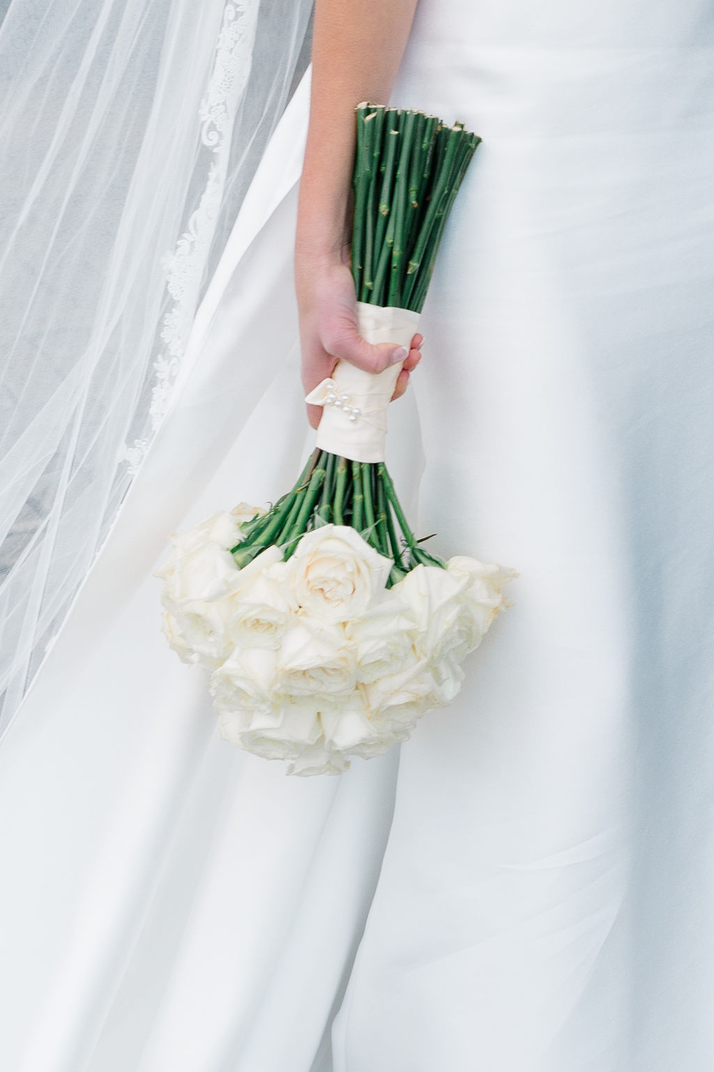 St. Mary’s Bristol RI Wedding | Newport Photography By Caprio Captured Light And Airy | Bride holding a white bouquet