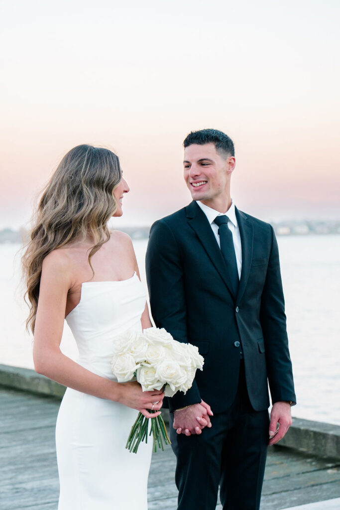 Glen Manor House Wedding Cost | Caprio Captured Photography Light and Airy Wedding Photography | Bride and groom holding hands at Glen Manor dock