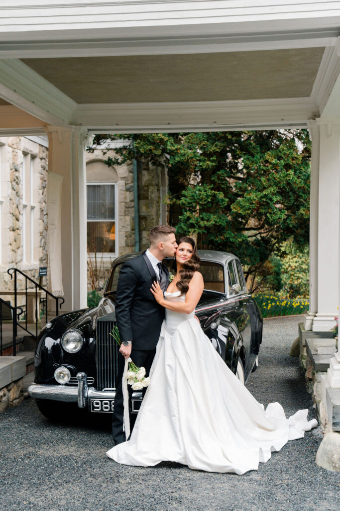Blithewold Wedding | Rhode Island Wedding Photographer | Bride and groom embracing in front of vintage car at Blithewold