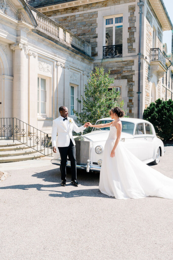 Aldrich Mansion Wedding | Bride and groom holding hands outside the Aldrich mansion