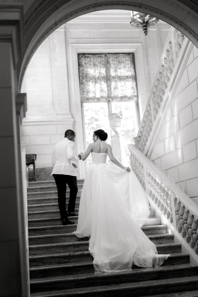 Aldrich Mansion Wedding | Bride and groom walking up Aldrich Mansion indoor stairs