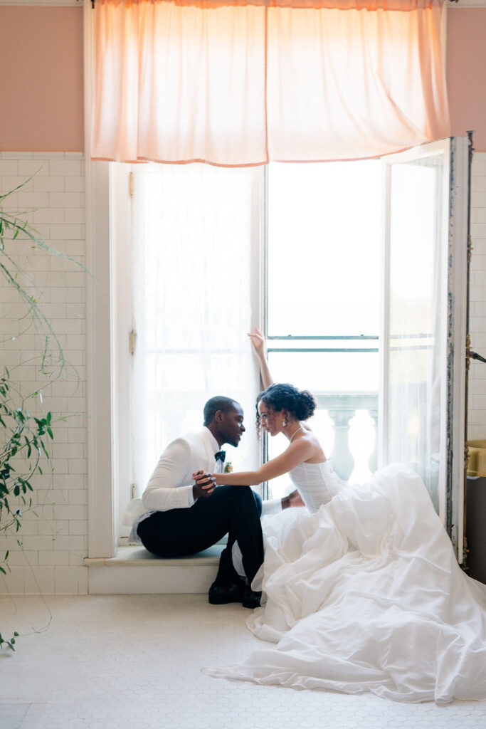 Aldrich Mansion Wedding | Bride and groom sitting by the window at Aldrich Mansion